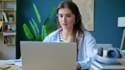 Woman Working from Home on Laptop, Taking Notes