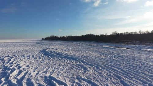 Breathtaking Frozen Sea Shore Scenery Under Expansive Blue Sky