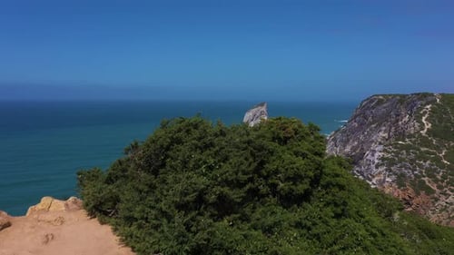 Ursa Beach Cliffs and Atlantic Ocean Waves on Sunny Day Portugal Aerial View
