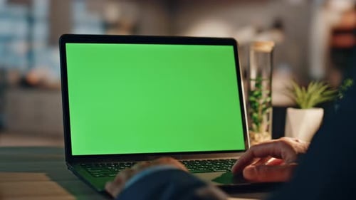 Closeup Worker Looking Greenscreen Monitor in Night Interior Man Working Laptop
