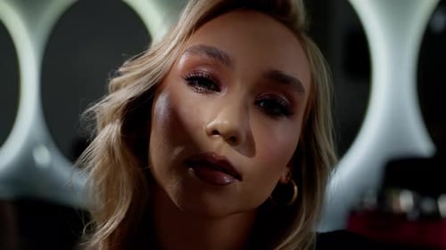 Blonde Woman with Professional Makeup Posing