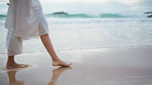 Legs Going Summer Beach on Cloudy Day Closeup Relaxed Woman Leaving Footprints