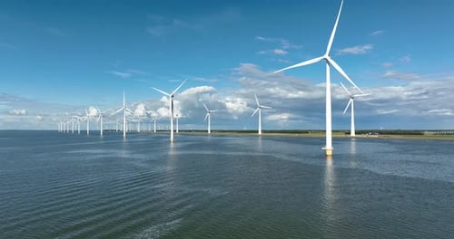 Wind farm in the sea. Clean energy production. Video background. Technology and innovation.