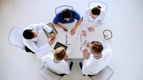 Medical Team Meeting at Table, Bird's Eye View