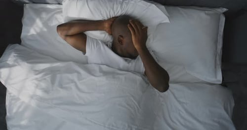 Man Wakes Up and Looks at Phone