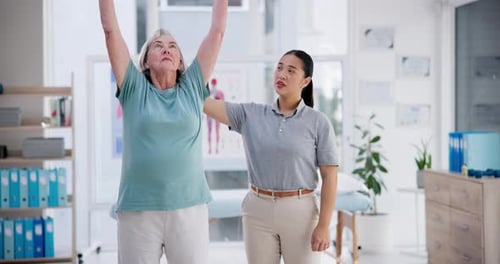 Woman Stretching Arms During Physical Therapy Session