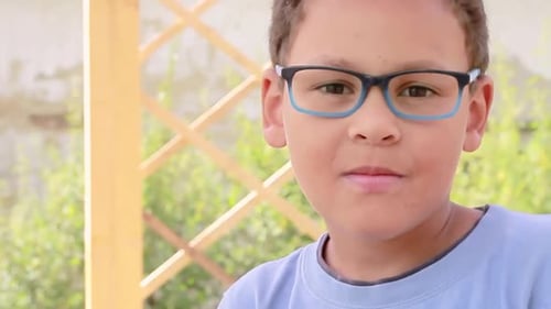 boy with a pair of glasses looking stylish and cool stock footage