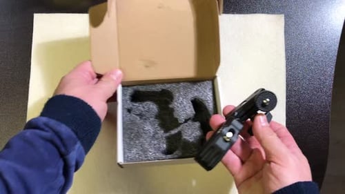 Camera Magic Arm Ball Head. A Tech Blogger Reviews A Camera Holder. He Takes It Out Of The Box And T
