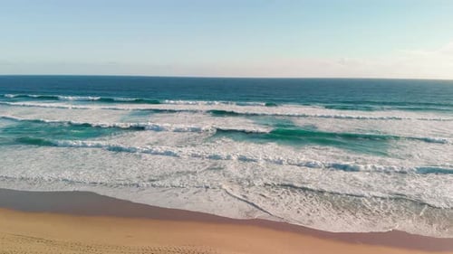 Drone view of beautiful sea waves on the beach, Aerial view of ocean shoreline, deep blue ocean wate