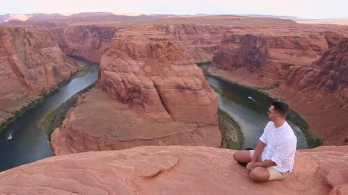 Happy Man on the Edge of the Cliff at Horseshoe Bend Canyon in Page Arizona Adventure and Tourism