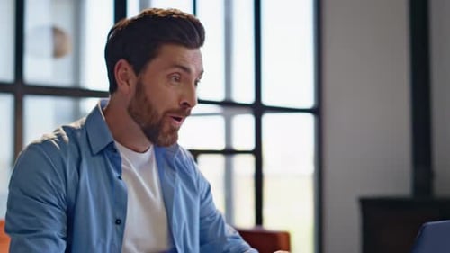 Man Working from Home Celebrates Success