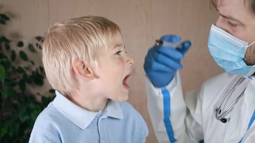 Child Receiving Medication from Doctor in Hospital