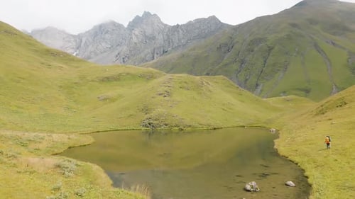 Woman Hiker Reach Alpine Nariana Lake, Georgia