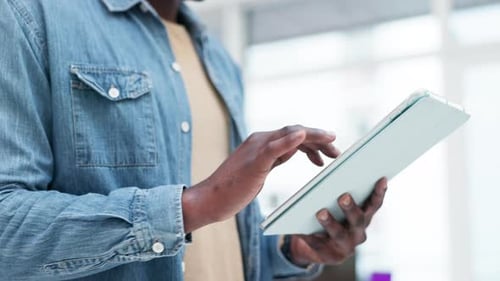 Person Using a Tablet Device Indoors