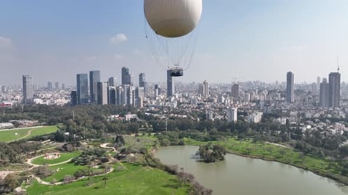 Aerial shot of a hot air balloon over Yarkon Park Tel Aviv, Israel
