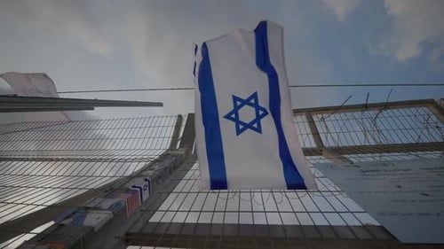 Israeli Flag Hanging on Metal Wire Fence