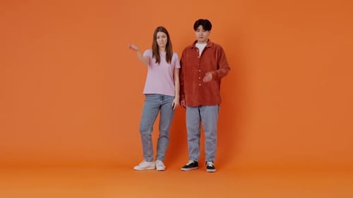 White Woman and Asian Man Make Sign of Disappointment