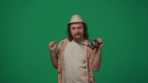 Man Dancing with Vintage Camera on Green Screen