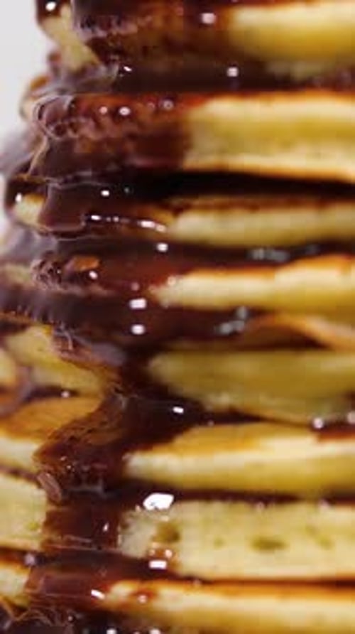 Vertical Screen Sweet Pancakes with Chocolate Syrup