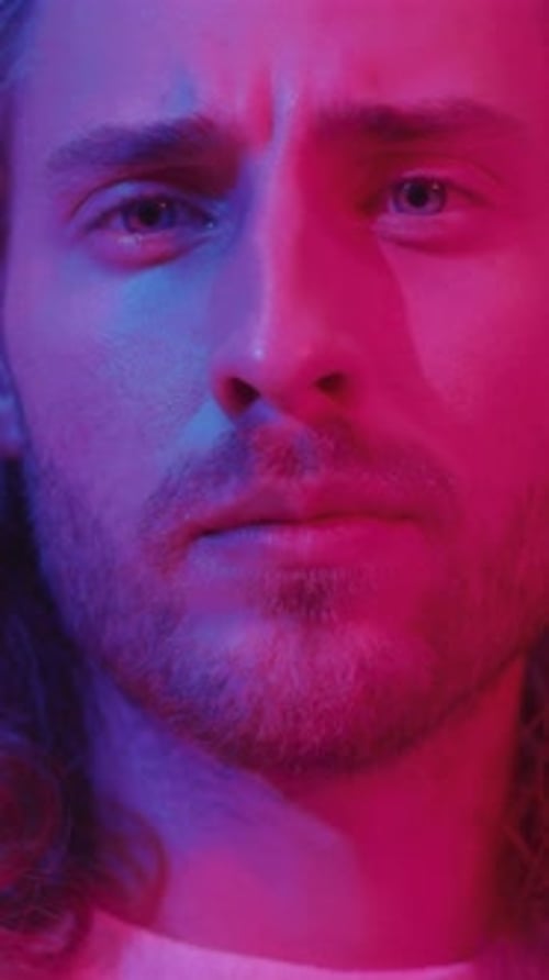 Man's Face Lit with Red and Blue Lights