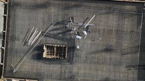 Aerial View of Construction Workers on Building Site