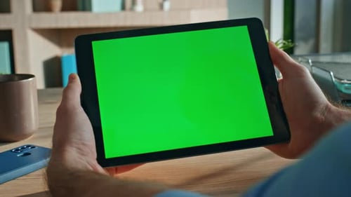 Company Employee Browsing Chroma Key Tablet Application at Workplace Close Up