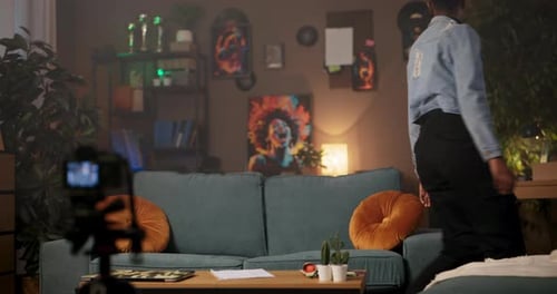 Architect or Interior Designer African Woman in Living Room Meticulously Sketches and Writes