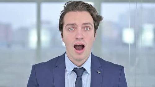 Shocked Man in a Suit Expressing Surprise