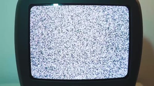 Old Television Displaying White Noise Static Screen