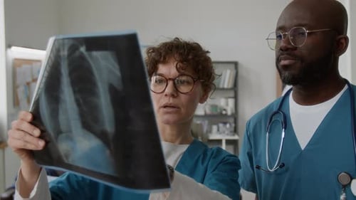 Doctors Analyzing X-Ray in Modern Hospital Setting