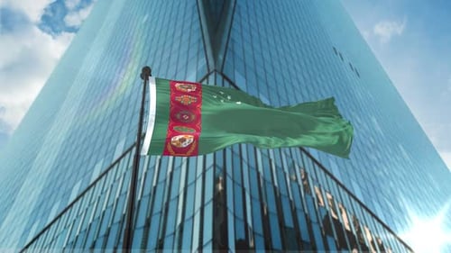 Waving Flag of Turkmenistan in Front of a Modern Skyscraper