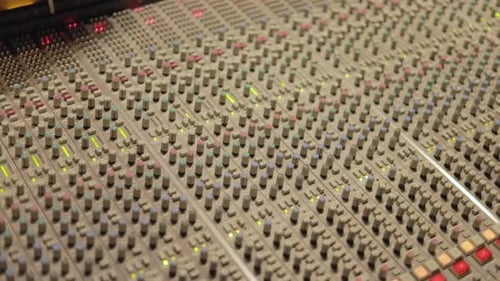 Professional Mixing Console, Mixing Desk With Speakers Inside The Studio. - close up shot