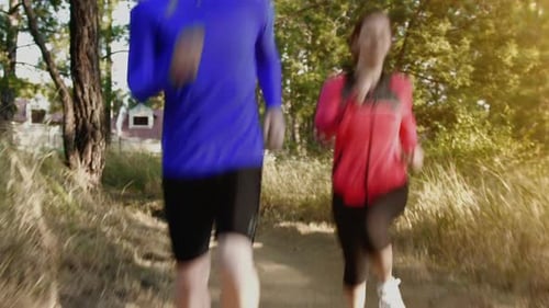 Running Couple on a Trail at Sunrise, Close Up Shoes Steadicam
