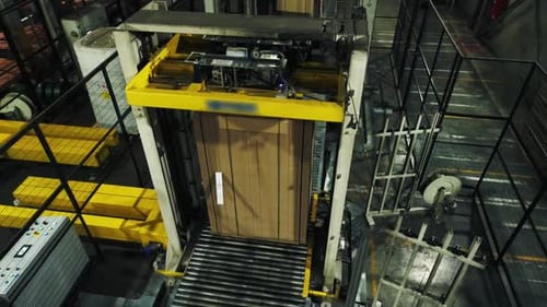 Wrapped Cardboard Paper Transported By Conveyor in Workshop