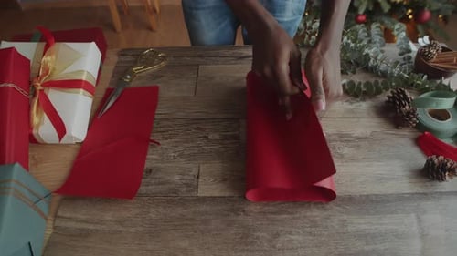 Wrapping Christmas Presents At Home Close Up