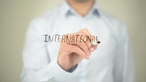 Writing International on Clear Surface