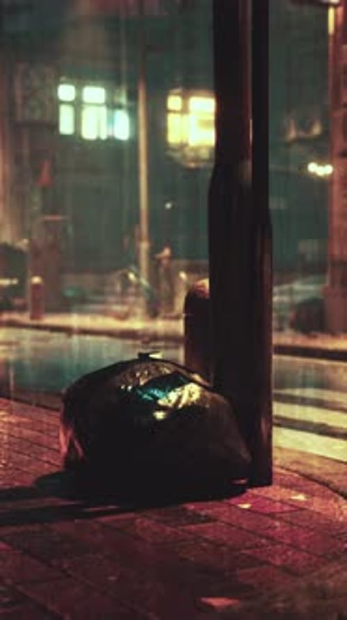 Atmospheric Grungy Urban Street Scene with Rain at Night