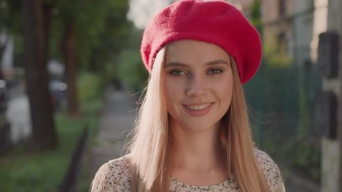 Attractive Fashion Blond Model Young Caucasian Woman in Elegant Red Beret Walking on Sunny Street