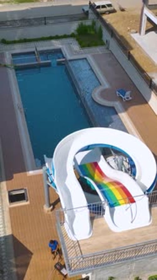 Vertical Video Fresh Water Flowing Into a Pool at a Beautiful Residential House