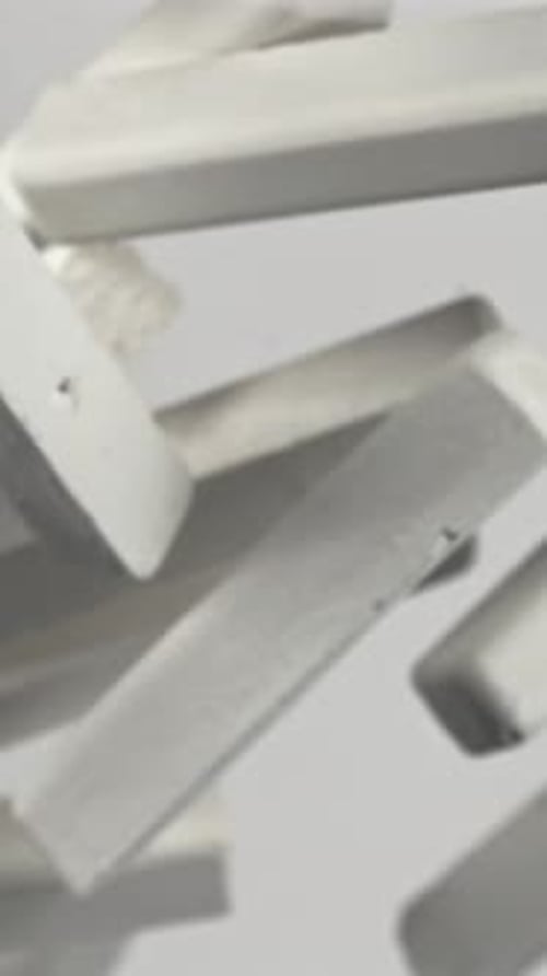 School Chalk Flying on a White Background Filmed on a Highspeed Camera at 1000 Fps