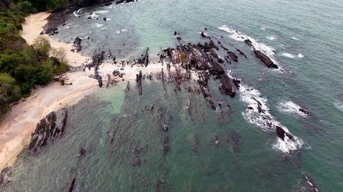 Aerial view of rocky coast with turquoise water