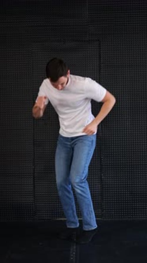Energetic Man Dancing Freestyle in a Studio