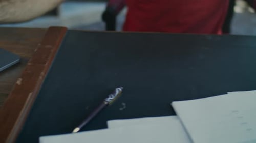 Hands typing on laptop and removing lock on phone at office evening