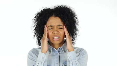 Woman Rubs Temples Experiencing Headache
