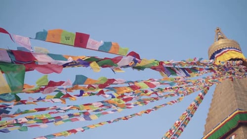 Prayer Flags At Boudhanath Stupa Swaying In The Air Against The Blue Sky In Kathmandu Valley, Nepal