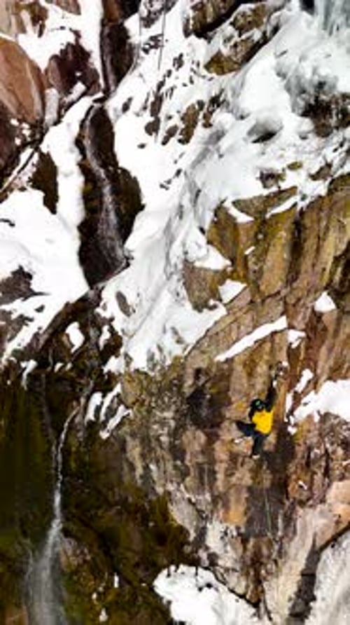 Mountaineer Climbing at Big Glacier Wall
