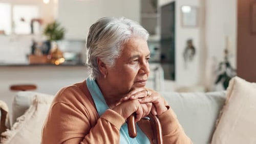 Senior woman, thinking and cane with depression, nursing home and mental health with retirement