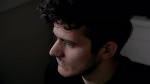 Close-Up Top View of Focused Man Working at Computer