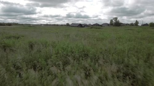 Top View of Old Village Houses in Green Field