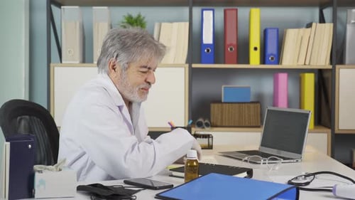 Doctor Gesturing, Telemedicine Consultation in an Office